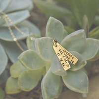 "All I can do is be me, Whoever that is." - Bob Dylan Quote Necklace - Chocolate and Steel