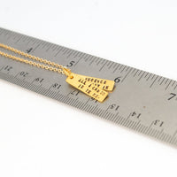 "All I can do is be me, Whoever that is." -Bob Dylan Quote Necklace - Chocolate and Steel