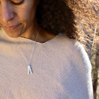 "All I can do is be me, Whoever that is." -Bob Dylan Quote Necklace - Chocolate and Steel