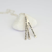 "Life Shrinks or Expands in Proportion to One's Courage" -Anais Nin Quote Necklace - Chocolate and Steel