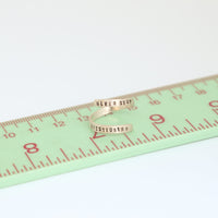 "Never Stop Questioning" - Einstein wrap ring - Chocolate and Steel