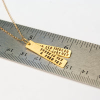 "There is not a word yet for old friends who've just met." Jim Henson Quote Necklace - Chocolate and Steel