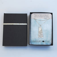 "What you think you become, what you feel you attract, what you imagine you create" -Buddha Quote Necklace - Chocolate and Steel