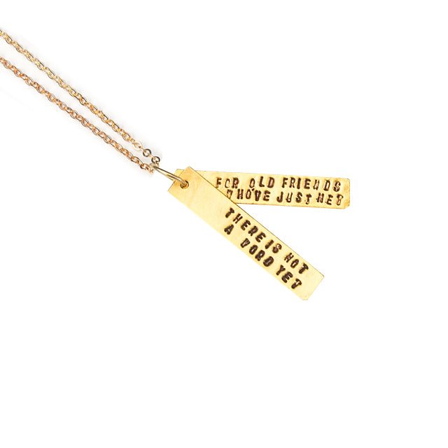 "There is not a word yet for old friends who've just met." Jim Henson Quote Necklace - Chocolate and Steel